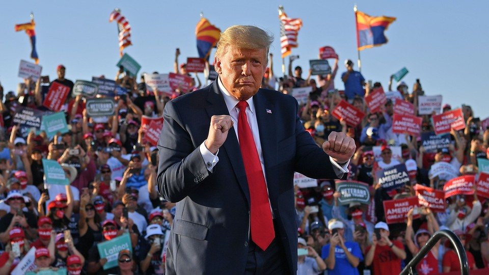 Donald Trump dancing in front of a crowd