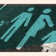 A photo-illustration of a parking space painted with the symbols of a family.