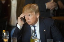 President Trump speaks on an iPhone