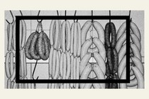 A black-and-white image of sausage links hanging on a rack