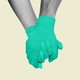 Two holding hands wearing green gloves