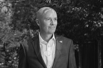 A black-and-white portrait photo of Utah Governor Spencer Cox