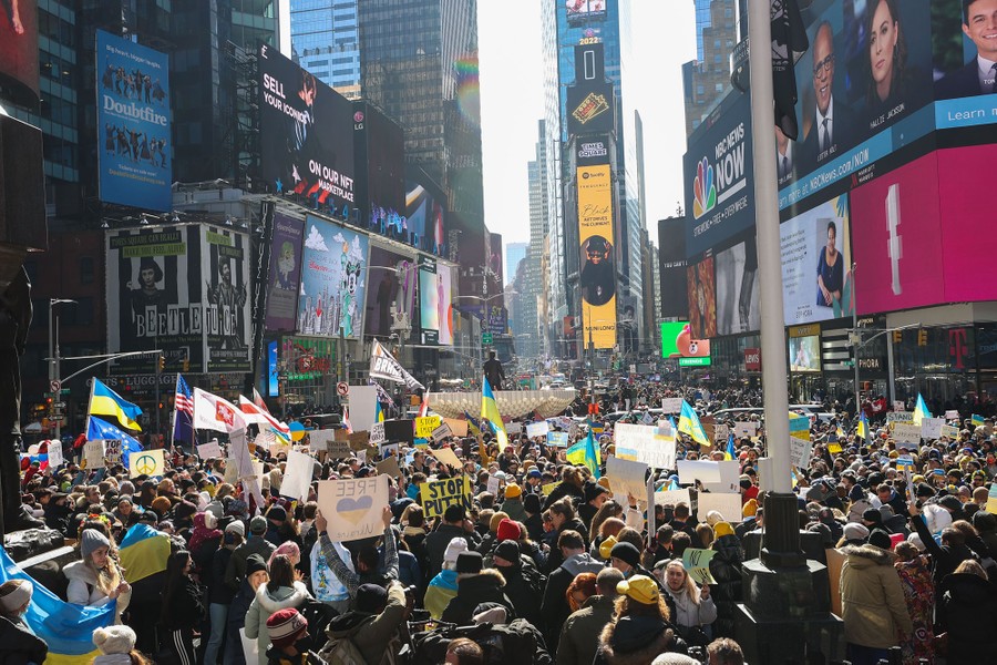 A large crowd of protesters fills New York's Times Square.