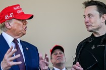 Donald Trump and Elon Musk staring at each other