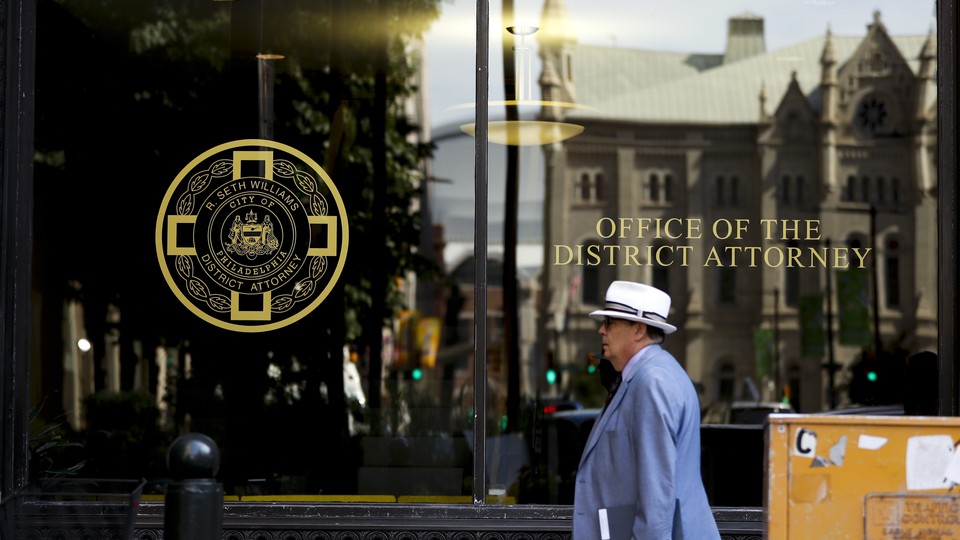 A man walks by the district attorney's office in Philadelphia