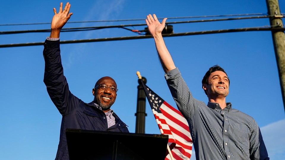 Georgia Democratic candidates for Senate Raphael Warnock and Jon Ossoff wave