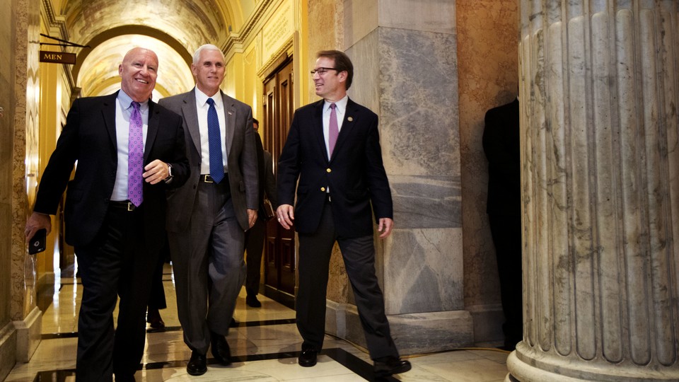 The House GOP's top tax-writers walking with Vice President Mike Pence