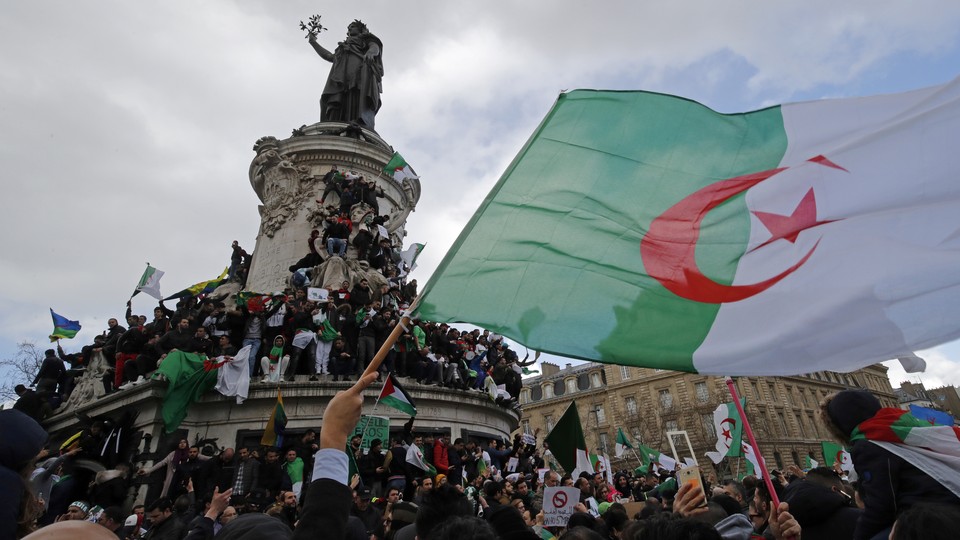 Hundreds of thousands of people protest in Paris against Algerian President Abdelaziz Bouteflika.