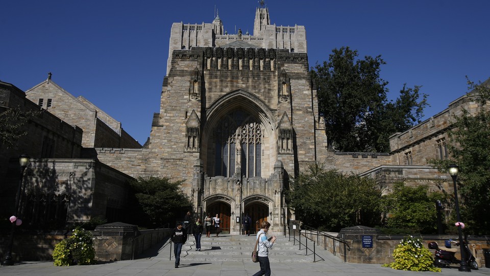 Students walk on the Yale University campus.