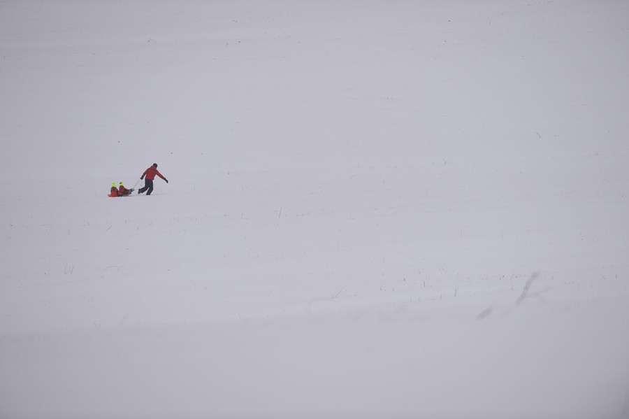 A father pulls his children in a sled through Valley Forge National Historical Park March 14, 2017 in Valley Forge, Pennsylvania.