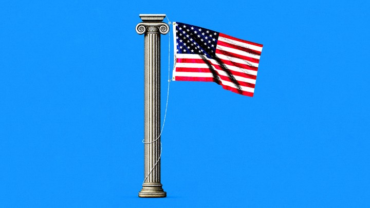An American flag hanging from a Greek column
