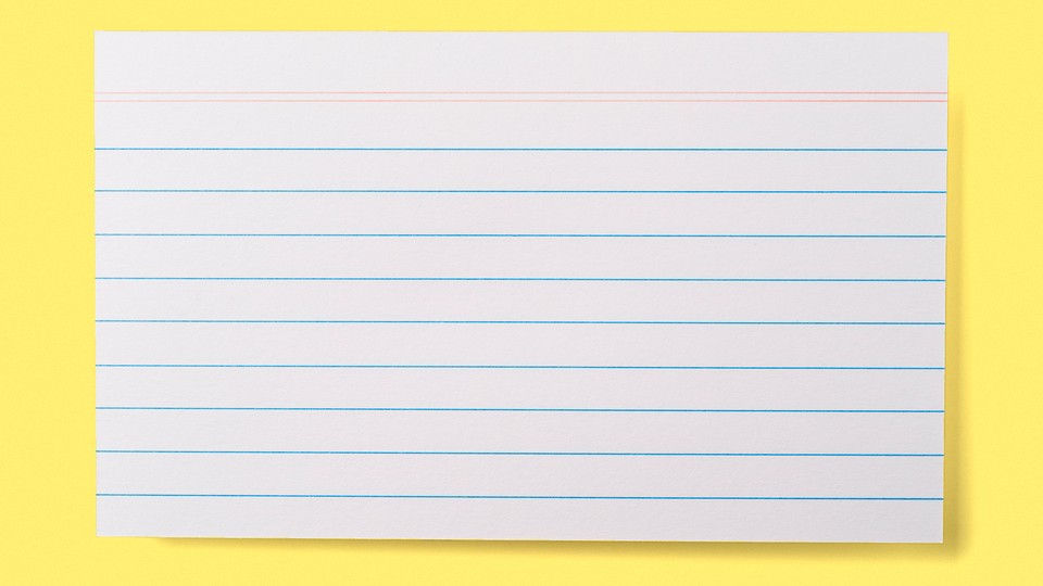A lined index card on a yellow background