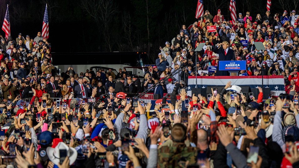 Former President Donald Trump prepares to speak during the'Save America' rally at the Montgomery County Fairgrounds in Conroe, Texas.