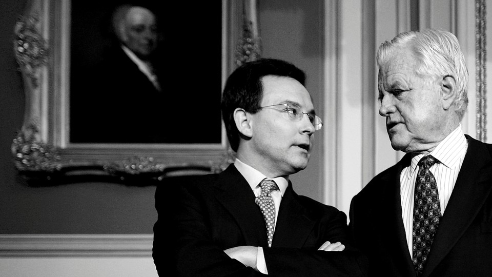 Simon Rosenberg, the New Democratic Network president and founder, talks with Senator Ted Kennedy during a news conference to promote comprehensive immigration reform in the U.S. Capitol.