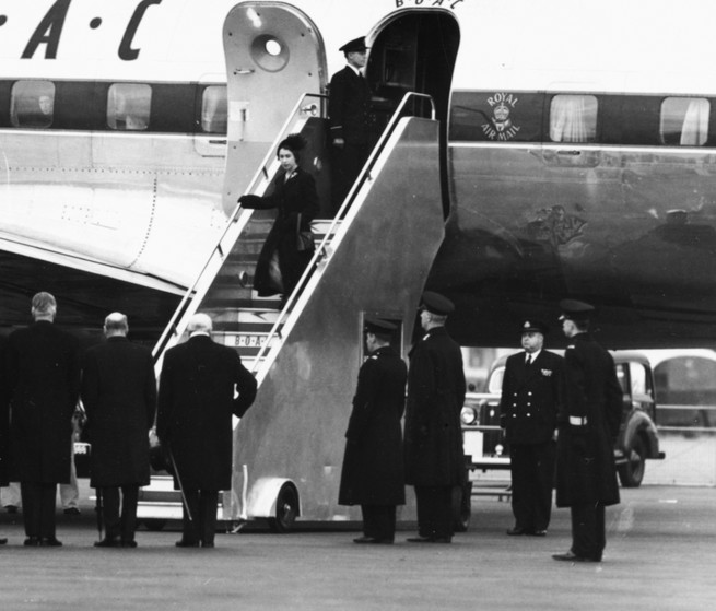 Queen Elizabeth descending from an airliner