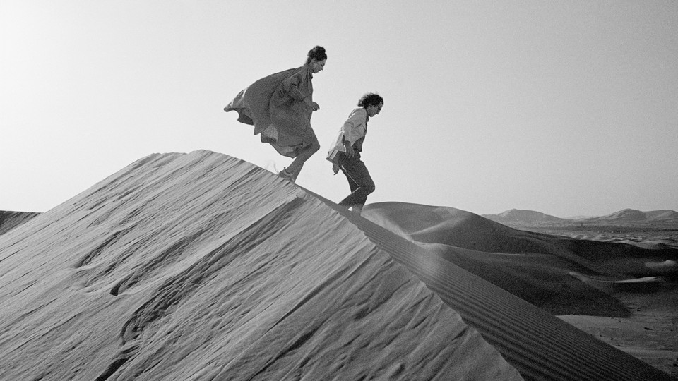 Christo and Jeanne-Claude looking for a possible site for The Mastaba for the United Arab Emirates in February 1982
