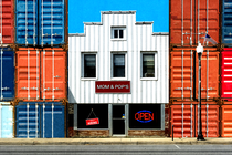 a small business between shipping containers