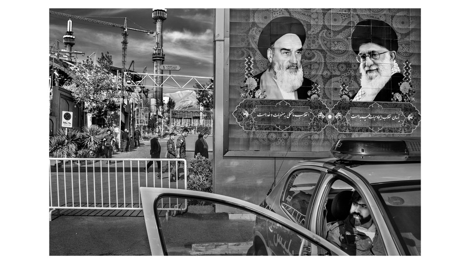 A mural on an exterior city wall in Iran shows Ayatollahs Khomeini and Khamenei.