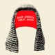 An illustration of a judge's wig atop a MAGA hat