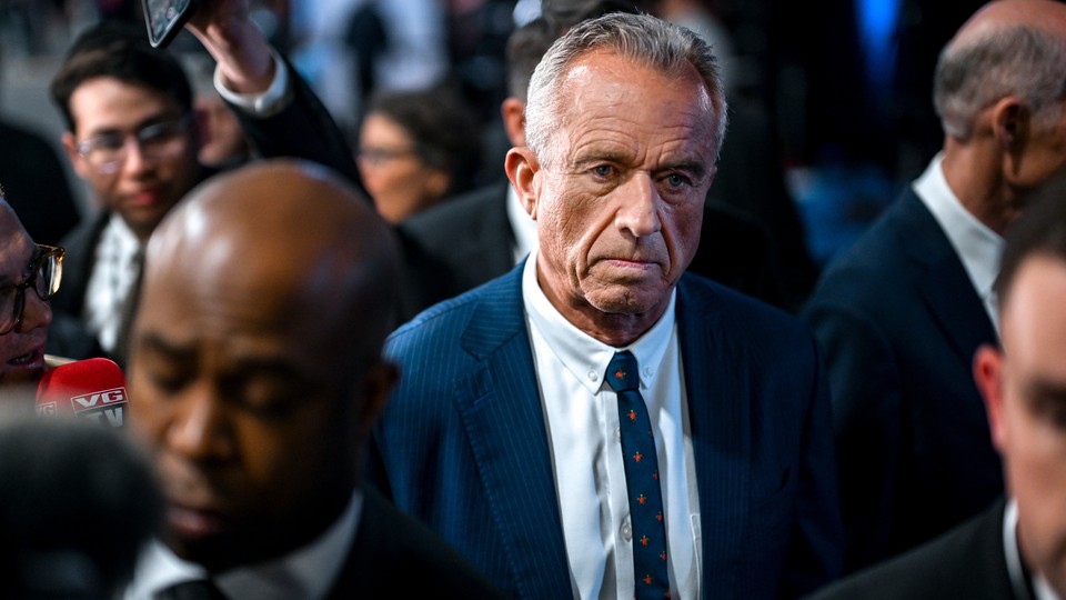 RFK Jr frowning in a crowd