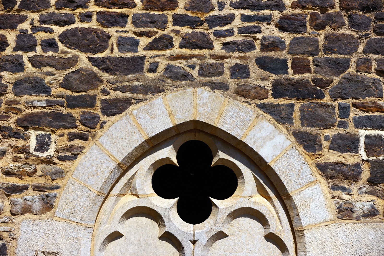 A close view of stonework and an arched opening in a castle wall