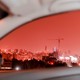Red-tinted Beirut captured through a car window