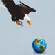 An eagle attacking a globe