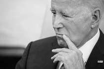 A black-and-white photo of President Joe Biden looking pensive