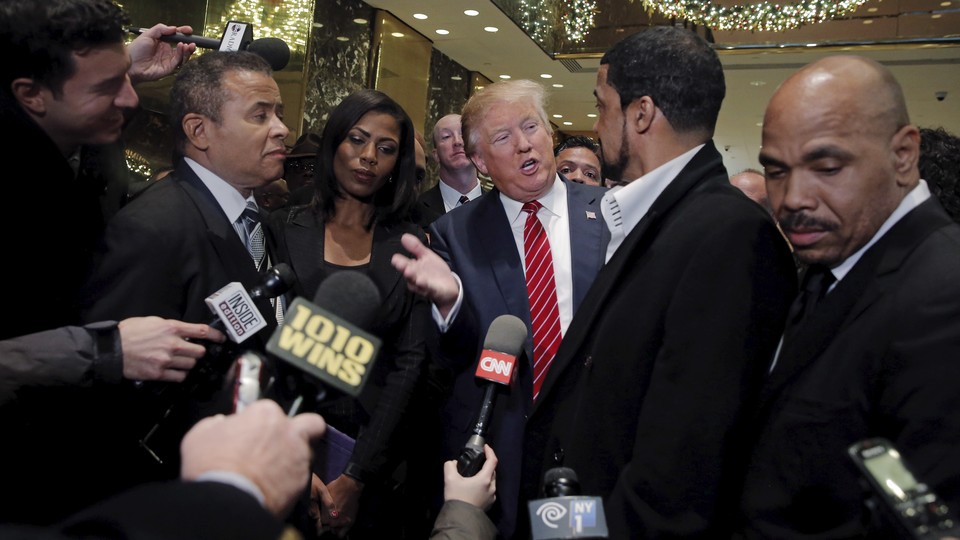 Donald Trump talking to reporters after a meeting with black pastors