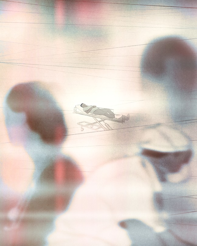 A figure on a stretcher watches as nurses and doctors walk by in the distance