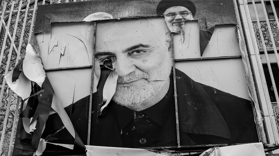 A broken picture of Iranian General Qassem Soleimani