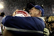 Tom Coughlin hugging a player after Super Bowl win
