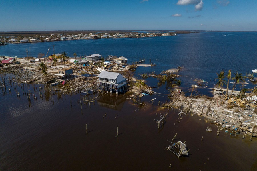 An aerial picture shows a devastated section of a low-lying island.