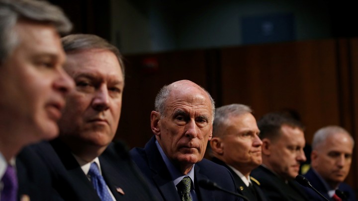National security leaders listen to testimony during a Senate Intelligence Committee hearing