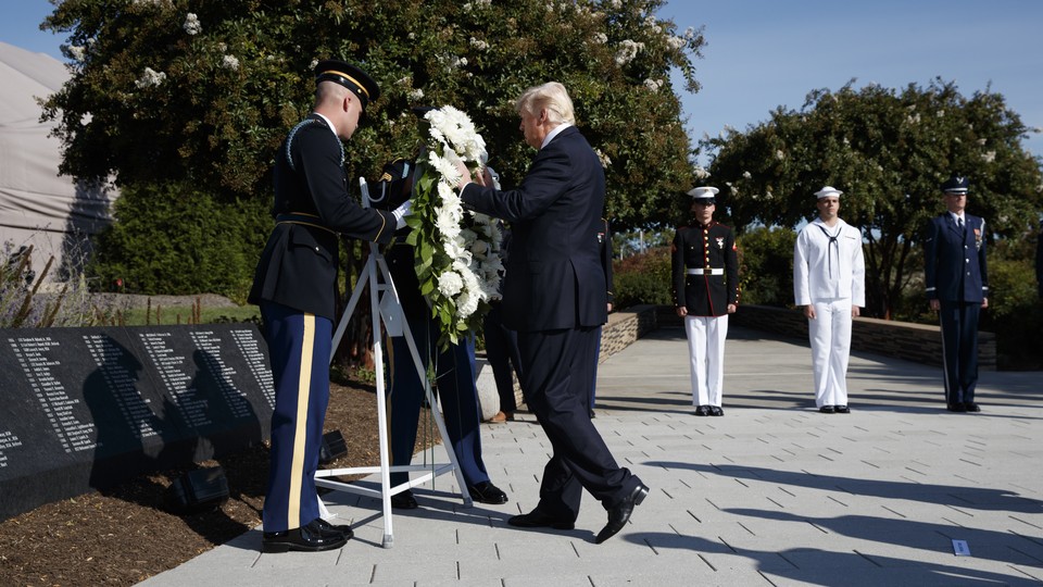 Donald Trump lays a wreath at the Pentagon at a 9/11 memorial service in 2017.