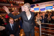 U.K. Prime Minister Theresa May waves to supporters