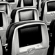 A black-and-white photo of a row of airplane seats