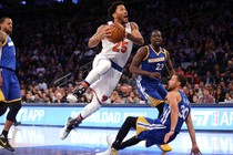 Derrick Rose (25), a point guard for the New York Knicks, drives against Stephen Curry (30) and Draymond Green (23) of the Golden State Warriors on March 5.