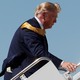 Money is seen in the back pocket of U.S. President Donald Trump as he boards Air Force One.