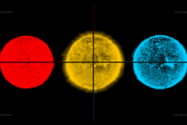 Three images of the sun in red, yellow, and blue—the products of observing our star in three different wavelengths