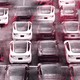 An image of Teslas in a parking lot