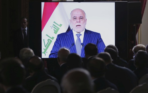 Iraqi Prime Minister Haider al-Abadi speaks via a videoconference during a ministerial summit in Paris on Mosul.