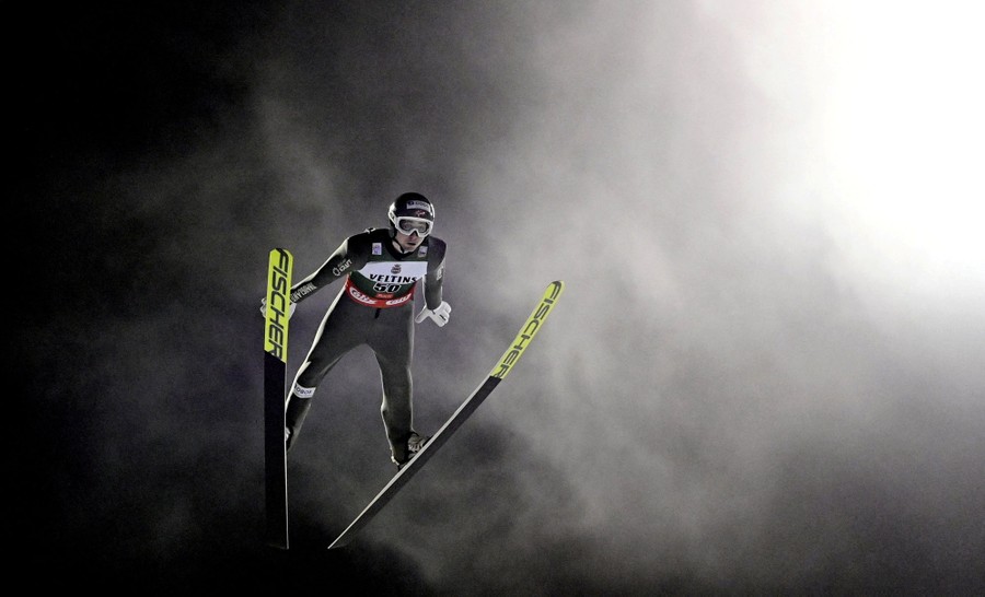 A ski jumper, photographed in mid-air