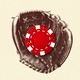 A baseball glove holding a poker chip
