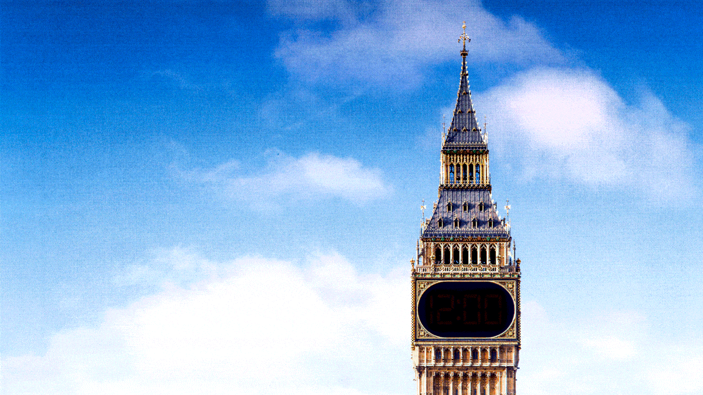 A GIF of Big Ben, with a digital alarm clock in place of the tower's analog clock face.