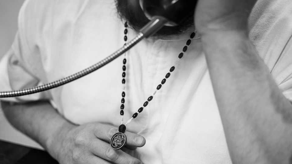 Texas death-row inmate John Henry Ramirez displaying his necklace with the star of David.