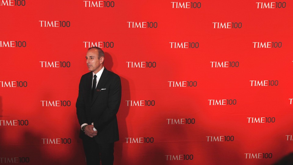 Matt Lauer stands in a suit in front of a red backdrop with the words "Time 100" written repeatedly behind him.