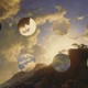 A photo of the sky with eight decorative holes in it