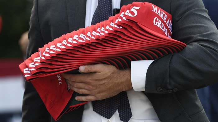 MAGA hat stack