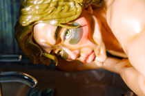 Man with chiseled face gazing down into a bathroom sink